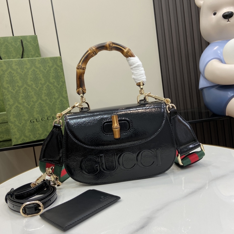 G*u*i top handle bags